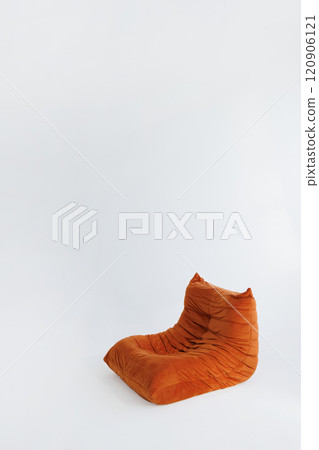Brown bean bag chair stands on white background. 120906121