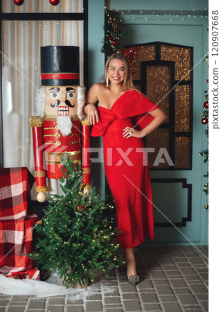 elegant woman in red dress with festive makeup elegant woman in red dress with festive makeup 120907668