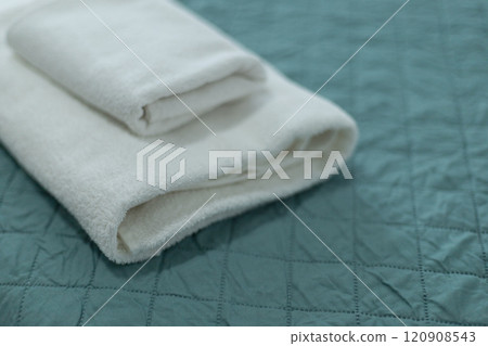 white towels are folded in the hotel on the bed 120908543