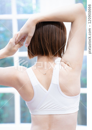 A young woman stretching 120908666