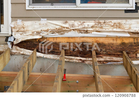 Removed Deck Ledger Board Reveals Dry Rotten Rim Joist Board with Extensive Damage on House 120908788