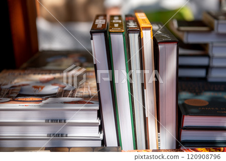 Books on the shelf in the market or bookstore or library. 120908796