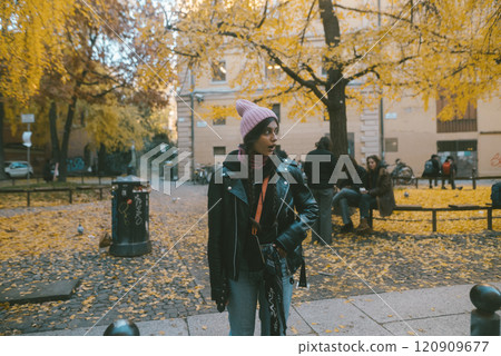 Embracing the Autumn Mood A Young Person Surrounded by Vibrant Golden Leaves in a Park Embracing the Autumn Mood A Young Person Surrounded by Vibrant Golden Leaves in a Park 120909677