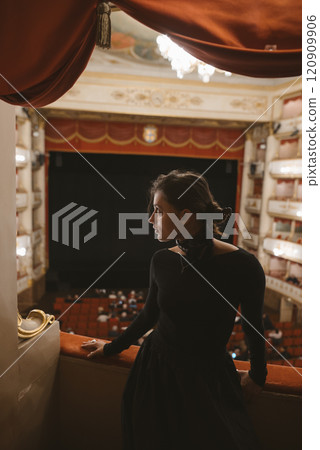 An Elegant Attendee in a Beautiful and Historic Theater Setting Embracing Rich Culture and Artistry 120909906