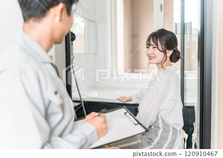 A housewife woman asking for an inspection of the bathroom, bath, bathtub, and bathroom 120910467