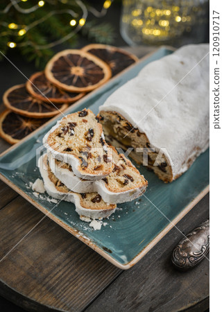 Traditional Christmas dessert made from sweet dough "Stollen" Traditional Christmas dessert made from sweet dough "Stollen" 120910717