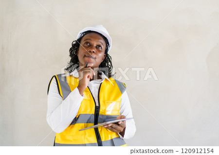 Senior professional African black female real estate foreman inspecting inside the building construction, foreman checking the under construction building. African female engineer inspects interior. Senior professional African black female real estate foreman inspecting inside the building construction, foreman checking the under construction building. African female engineer inspects interior. 120912154