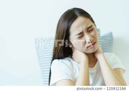 Unhappy - unwell Asian young woman having a mental health problem, woman feels uncomfortable after woke up from the bed. Young woman got a depression problem and mental burnout. 120912166