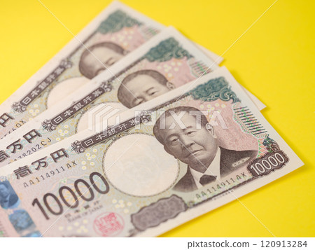 New 10,000 yen note featuring Eiichi Shibusawa on yellow background 120913284