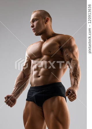 Handsome bodybuilder full-length view 120913636