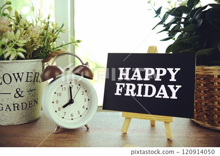 Happy Friday text on paper card with ealsel on wooden background 120914050