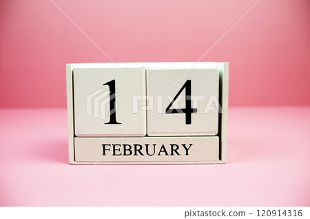 14 February wooden calendary on pink background Valentine's Day concept 120914316