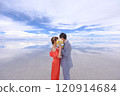 Uyuni Salt Flats | Fantastic wedding photo of couples hiding their faces with a bouquet of flowers and kissing 120914684