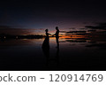 Sunrise at the Uyuni Salt Flats | A beautiful moment when two people hold hands and pledge their love 120914769