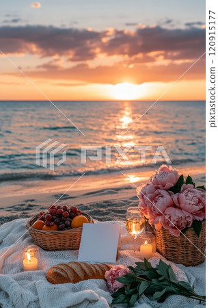 Sunset picnic with fruits and flowers beachside lifestyle serene environment relaxed viewpoint romantic concept for memorable moments 120915177