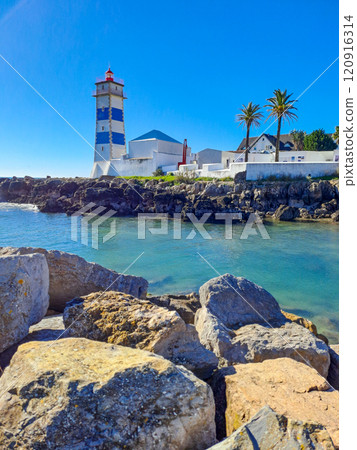 Santa Marta lighthouse in Cascais Portugal. Atlantic Ocean coast Santa Marta lighthouse in Cascais Portugal. Atlantic Ocean coast 120916314