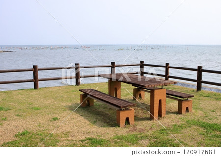 Bench at a roadside station by the sea 120917681