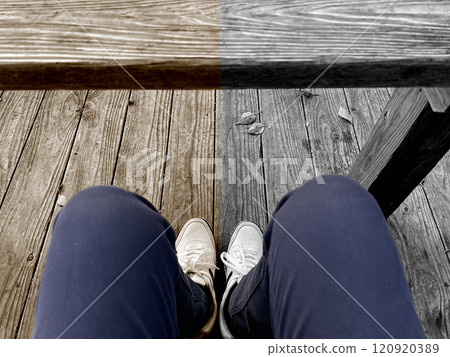 Man's legs and shoes sitting on a wooden chair Inverted floor color design 120920389