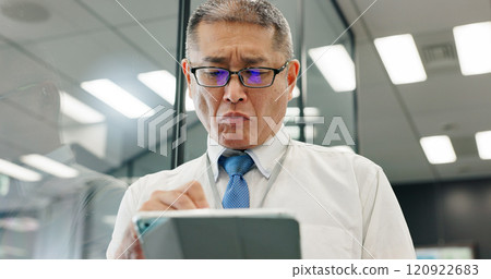 Tablet, mature and business man research online, reading email or check insurance policy on app. Japanese person, digital technology or manager planning project, risk management or feedback in office Tablet, mature and business man research online, reading email or check insurance policy on app. Japanese person, digital technology or manager planning project, risk management or feedback in office 120922683