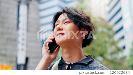 Japanese man, talking and phone call for communication, discussion and booking with travel in city. Person, happy and mobile outdoor for listening, conversation and morning commute with chat. 120922684