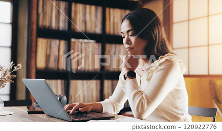 Japanese, woman and typing on laptop at house for schedule, email and mortgage application. Person, online and thinking with financial solution, investment feedback and property insurance in Japan 120922776