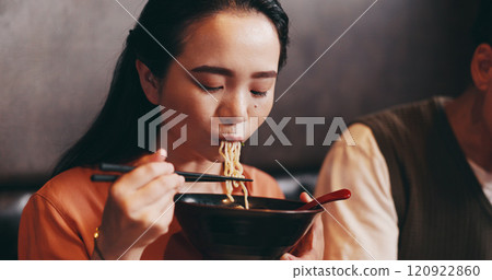 Japanese woman, eating lunch and man in restaurant for date, bonding together and healthy meal. Female person, hospitality and diet with traditional cuisine, chopsticks or ramen noodles as asian food 120922860