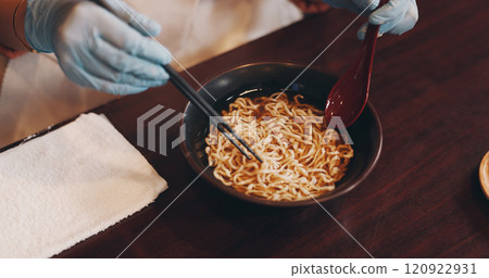 Asian restaurant, ramen and hands of chef with noodles for dinner, lunch and supper. Culinary, traditional cuisine and person with chopsticks for healthy eating, nutrition and gourmet dish in Japan Asian restaurant, ramen and hands of chef with noodles for dinner, lunch and supper. Culinary, traditional cuisine and person with chopsticks for healthy eating, nutrition and gourmet dish in Japan 120922931