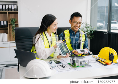 business people having consultation about wind energy at company office. on architectural project site and making model house. 120922977