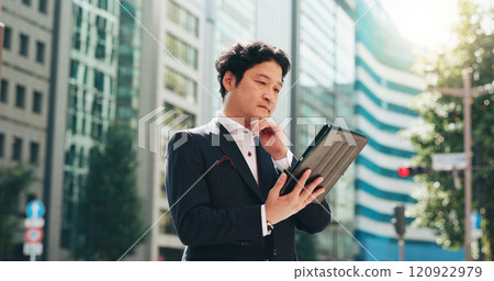 Man, thinking and tablet in city for business, travel and research for urban development in Osaka. Mature investor, tech or reading in Japanese town for news, investment opportunity or economy growth 120922979