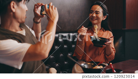 Couple, food and photo on date in restaurant for happy memory, profile picture update and social media post. Japanese people, ramen bowl and smile with video recording in cafe for bonding and dining Couple, food and photo on date in restaurant for happy memory, profile picture update and social media post. Japanese people, ramen bowl and smile with video recording in cafe for bonding and dining 120923014
