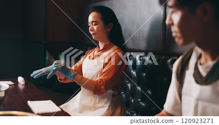 Cooking, gloves and start with Japanese woman in restaurant for fine dining course, dinner and learning recipe. Ingredients, culture and food with asian people in class for diet, menu and meal prep Cooking, gloves and start with Japanese woman in restaurant for fine dining course, dinner and learning recipe. Ingredients, culture and food with asian people in class for diet, menu and meal prep 120923271