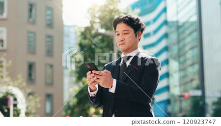 Man, reading and phone in city for business, travel and research for urban development in Tokyo. Mature investor, mobile and scroll in Japanese town for news, investment opportunity or economy growth 120923747