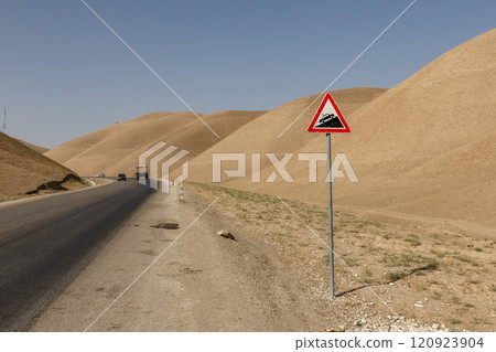 Afghan Desert Road with Warning Sign and Rolling Hills, Faryab Province, Afghanistan Afghan Desert Road with Warning Sign and Rolling Hills, Faryab Province, Afghanistan 120923904