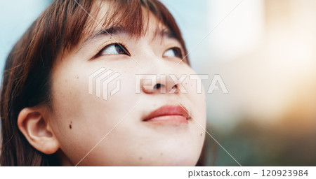 Japanese woman, thinking and travel in city with reflection, sunshine and sightseeing in summer. Person, outdoor and perspective in urban street for commute, tourism or search for location in town 120923984