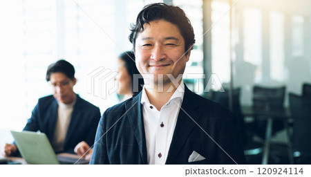 Portrait, Japanese businessman and pride in office for teamwork, collaboration and networking. Male person, happy and meeting as project manager for architecture firm with confidence, smile and staff 120924114