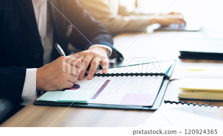 Businessman, hands and sign paper in office for contract renewal, partnership agreement or legal document. Corporate professional, form or pen in Japanese agency for investment, company NDA or policy 120924365