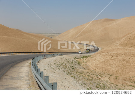 Scenic road winding through arid hills in Faryab Province, Afghanistan 120924692