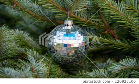 Christmas tree with mirrored bauble, festive decoration. Holiday ornament and winter celebration concept 120925106