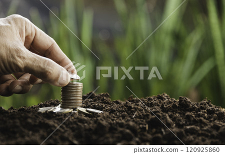 Hand with money coins stack, Business investment growth concept, saving concept, Hand putting stack of coin. Hand with money coins stack, Business investment growth concept, saving concept, Hand putting stack of coin. 120925860