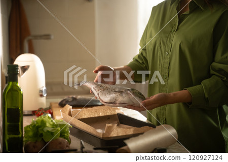 Cooking Dorado Fish on a Baking Sheet for a Flavorful Meal 120927124