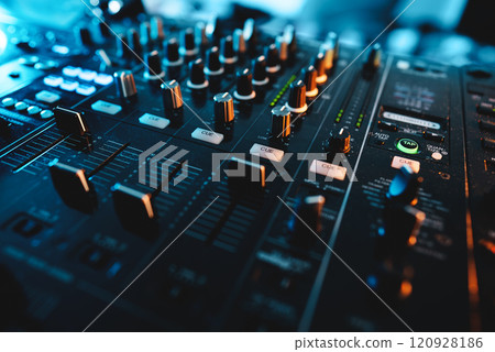 closeup of professional digital pioneer dj decks and audio mixer equipment ready for party in nightclub closeup of professional digital pioneer dj decks and audio mixer equipment ready for party in nightclub 120928186