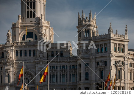 Madrid city hall with Spanish flags at sunset, Ayunmtamiento building 120928188