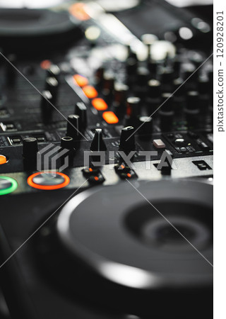 closeup of professional digital pioneer dj decks and audio mixer equipment ready for party in nightclub closeup of professional digital pioneer dj decks and audio mixer equipment ready for party in nightclub 120928201