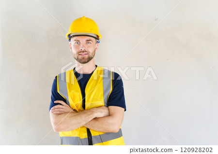Portrait of smart and good looking caucasian white male foreman or construction contractor smiles to camera and looks away. Close up shot of construction engineer - foreman with copyspace. Portrait of smart and good looking caucasian white male foreman or construction contractor smiles to camera and looks away. Close up shot of construction engineer - foreman with copyspace. 120928202
