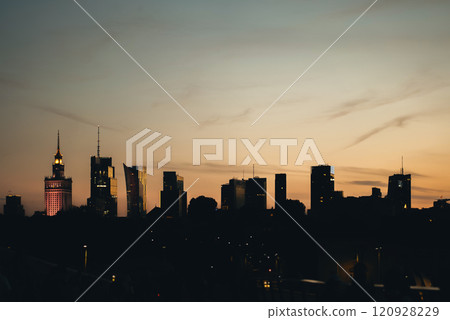 panorama of Warsaw city skyline at sunset, skyscrapers of downtown silhouette, blue sky on background, capital of Poland business district 120928229