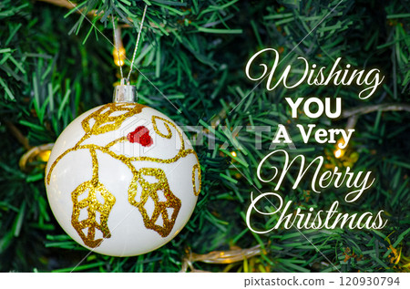 Wishing you a very Merry Christmas text with white Christmas ball background. Christmas celebration concept 120930794