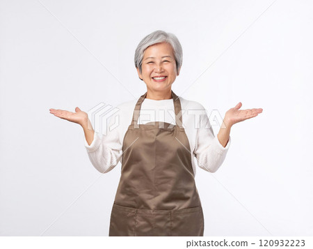 A woman in an apron A woman in an apron 120932223