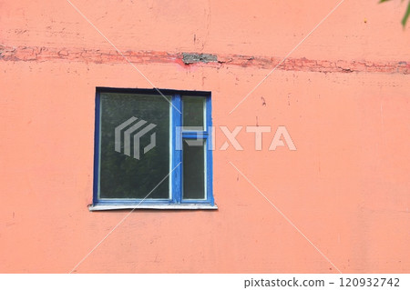 Grunge urban background texture of old orange concrete wall with window, blue wooden frame. 120932742