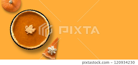 Homemade pumpkin pie with autumn decorations for Thanksgiving Day. 120934230