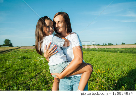 High angle view of happy mother playing with children in  field. 120934984